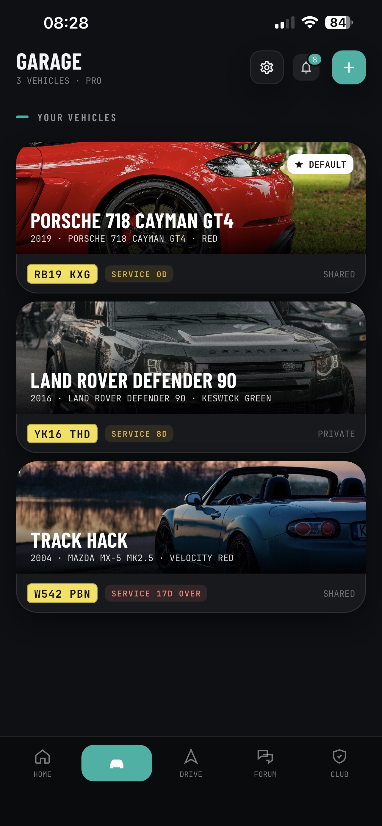 RevBase Garage screen listing three cars, a Porsche 718 Cayman GT4, a Land Rover Defender 90 and a Mazda MX-5, each with its registration and service countdown